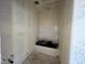 Unfinished bathroom area with tub shower combination, perfect for customization at 47706 W Kenner Dr, Maricopa, AZ 85139