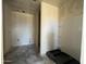 Unfinished bathroom with shower and plumbing fixtures, ready for your personal touch at 47706 W Kenner Dr, Maricopa, AZ 85139