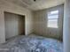 Unfinished bedroom showcasing closet space and a window, ready for personalization at 47706 W Kenner Dr, Maricopa, AZ 85139