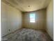 Unfinished bedroom with window, perfect for customization and design at 47706 W Kenner Dr, Maricopa, AZ 85139