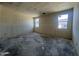 Unfinished bedroom featuring bright natural light from dual windows, awaiting personalization at 47706 W Kenner Dr, Maricopa, AZ 85139
