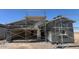 New construction exterior of a single Gathering home with stucco and scaffolding at 47706 W Kenner Dr, Maricopa, AZ 85139