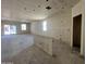 Spacious unfinished living room featuring a window, ready for customization and design at 47706 W Kenner Dr, Maricopa, AZ 85139