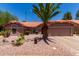 Charming single-story home boasts a desert-landscaped yard, a terracotta tile roof, and attached two-car garage at 5580 W Kesler St, Chandler, AZ 85226