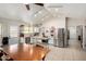 Spacious kitchen features white cabinets, stainless steel appliances, a large wooden center island, and tile flooring at 5580 W Kesler St, Chandler, AZ 85226
