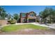 Charming two-story home with a well-manicured lawn and inviting front porch at 7274 W State Ave, Glendale, AZ 85303