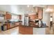 Bright kitchen featuring an island, stainless appliances, and ample cabinet space at 7274 W State Ave, Glendale, AZ 85303