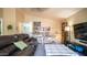 Comfortable living area featuring a vaulted ceiling and views into another living area at 7274 W State Ave, Glendale, AZ 85303