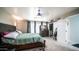 Cozy main bedroom with a comfortable bed, dresser, and closet space at 7274 W State Ave, Glendale, AZ 85303