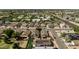 Wide aerial of residential community; home features updated solar panels and backyard pool at 8668 N 107Th Dr, Peoria, AZ 85345