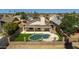 Backyard featuring a kidney shaped pool and fenced in yard perfect for outdoor relaxation and entertaining at 8668 N 107Th Dr, Peoria, AZ 85345