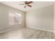 Inviting bedroom featuring wood-look floors and plenty of natural light at 8668 N 107Th Dr, Peoria, AZ 85345