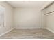 Bright and airy bedroom featuring wood-look floors, closet, ceiling fan and window at 8668 N 107Th Dr, Peoria, AZ 85345
