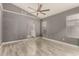 Large bedroom with a vaulted ceiling and view into the bathroom at 8668 N 107Th Dr, Peoria, AZ 85345