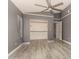 Spacious primary bedroom featuring vaulted ceilings, ceiling fan and large closet at 8668 N 107Th Dr, Peoria, AZ 85345