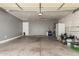 Spacious garage with ample storage and a convenient side entry door at 8668 N 107Th Dr, Peoria, AZ 85345