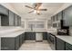 Updated kitchen with stainless steel appliances, quartz countertops and mosaic tile backsplash at 8668 N 107Th Dr, Peoria, AZ 85345