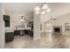 Open-concept living space with kitchen and dining area featuring modern finishes and appliances at 8668 N 107Th Dr, Peoria, AZ 85345