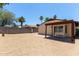 Backyard with block wall, large patio slider, palm trees and low maintenance landscape at 934 E Wahalla Ln, Phoenix, AZ 85024