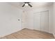 Comfortable bedroom with closet and modern wood-look floors at 934 E Wahalla Ln, Phoenix, AZ 85024
