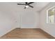 Cozy bedroom boasts a ceiling fan and ample natural light at 934 E Wahalla Ln, Phoenix, AZ 85024