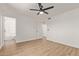 Bright bedroom featuring wood-look floors and ensuite bathroom at 934 E Wahalla Ln, Phoenix, AZ 85024