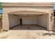Large open garage with door to the house and automatic door. Empty and ready for your cars at 934 E Wahalla Ln, Phoenix, AZ 85024