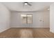 Bright and airy living room featuring modern flooring and a ceiling fan fixture at 934 E Wahalla Ln, Phoenix, AZ 85024