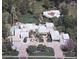 Expansive estate showcasing lush landscaping, a sparkling pool, and a circular driveway at 94 Biltmore Estates Dr, Phoenix, AZ 85016