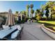 Manicured backyard features lush lawns, mature trees, and a comfortable patio space at 94 Biltmore Estates Dr, Phoenix, AZ 85016