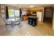Eat-in kitchen featuring stainless appliances, an island with bar seating, and abundant natural light at 94 Biltmore Estates Dr, Phoenix, AZ 85016