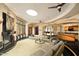 Open concept living room boasts a fireplace, bar, and large windows for natural light at 94 Biltmore Estates Dr, Phoenix, AZ 85016