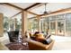 Spacious living area with floor-to-ceiling windows, custom furniture, and great light at 94 Biltmore Estates Dr, Phoenix, AZ 85016