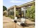Tranquil outdoor patio with desert plants and shade trees at 94 Biltmore Estates Dr, Phoenix, AZ 85016
