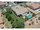 Beautiful aerial view of a home featuring a sparkling pool, well-maintained lawn and mature landscaping at 23090 S 201St St, Queen Creek, AZ 85142