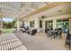 Comfortable covered patio with ample seating, ceiling fan, and views of the landscaped yard at 23090 S 201St St, Queen Creek, AZ 85142