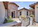 Welcoming entrance featuring decorative stonework and a beautifully landscaped courtyard at 23090 S 201St St, Queen Creek, AZ 85142