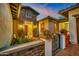 Charming single-story home with stone accents, desert landscaping, and a cozy front porch entry at 23090 S 201St St, Queen Creek, AZ 85142