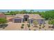 Beautiful single-story home with manicured desert landscaping and a brick driveway at 23090 S 201St St, Queen Creek, AZ 85142