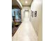 An interior hallway features tile flooring and connects the dining room to other living spaces at 23090 S 201St St, Queen Creek, AZ 85142