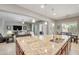Open-concept kitchen showcasing granite countertops, stainless steel sink, and seamless connection to the living area at 23090 S 201St St, Queen Creek, AZ 85142