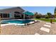 Inviting pool and patio area with ample seating, creating a perfect outdoor oasis at 10342 E Obispo Ave, Mesa, AZ 85212