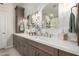 Beautiful bathroom with dual sinks, modern fixtures, and stylish accents at 10342 E Obispo Ave, Mesa, AZ 85212