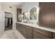 A spacious bathroom featuring a double vanity with modern sinks and a walk-in closet at 10342 E Obispo Ave, Mesa, AZ 85212