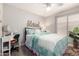 Cozy bedroom with a ceiling fan and a comfortable bed at 10342 E Obispo Ave, Mesa, AZ 85212