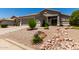 Welcoming single-story residence with a two-car garage and xeriscaping for low water usage at 10342 E Obispo Ave, Mesa, AZ 85212