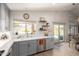 A well-lit kitchen with a view of the backyard pool area through a large window above the sink at 10342 E Obispo Ave, Mesa, AZ 85212