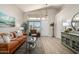 Comfortable living room with high ceilings, lots of light, tasteful décor, and durable floors at 10342 E Obispo Ave, Mesa, AZ 85212