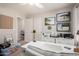 Bright and organized home office with a modern desk and beach-themed art at 10342 E Obispo Ave, Mesa, AZ 85212