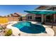 Sparkling pool with lounge areas, landscaping and covered patio; perfect for outdoor entertaining at 10342 E Obispo Ave, Mesa, AZ 85212